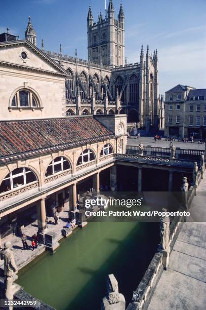 An overhead view of the Roman Baths with Bath Abbey beyond at Bath in Somerset, circa May 1985.