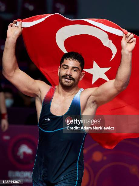 Taha Akgul from Turkey celebrates victory and the gold medal in the Final Free Style 125 kg weight during 2021 Senior European Championships United...