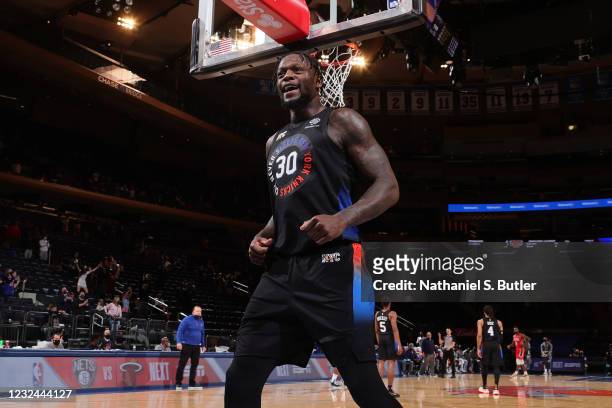 Julius Randle of the New York Knicks smiles and runs up court against the New Orleans Pelicans on April 18, 2021 at Madison Square Garden in New York...