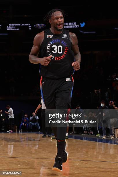 Julius Randle of the New York Knicks smiles and runs up court against the New Orleans Pelicans on April 18, 2021 at Madison Square Garden in New York...