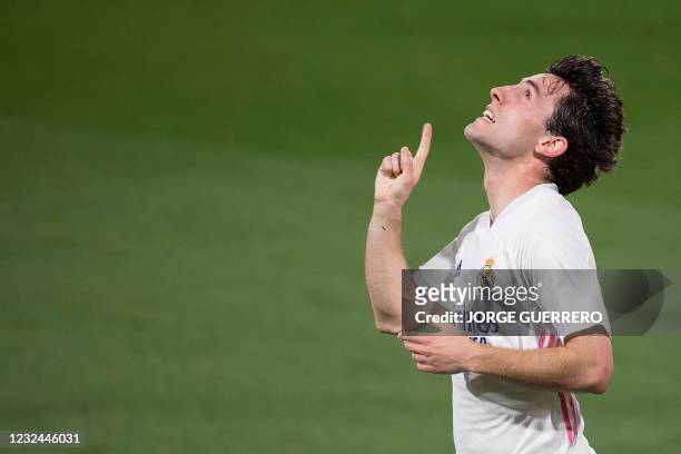 Real Madrid's Spanish defender Alvaro Odriozola celebrates after scoring a goal during the Spanish League football match between Cadiz and Real...