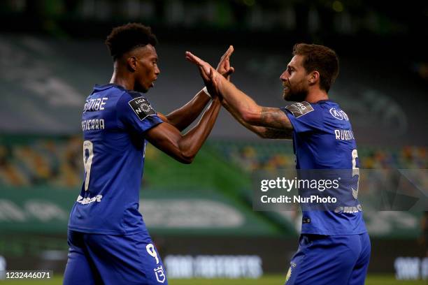 Mateo Cassierra of Belenenses SAD celebrates with Ruben Lima after scoring a goal during the Portuguese League football match between Sporting CP and...
