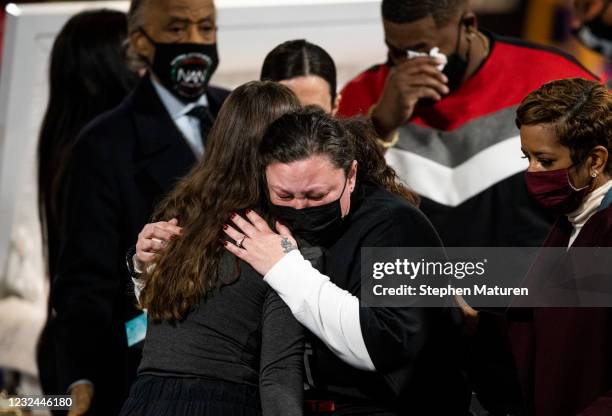 Katie Wright , mother of Daunte Wright, is embraced during a wake for Wright at Shiloh Temple International Ministries church on April 21, 2021 in...