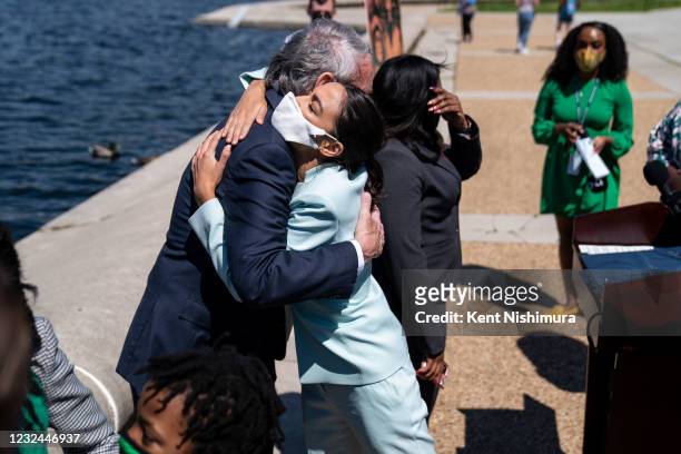 Rep. Alexandria Ocasio-Cortez hugs Sen. Ed Markey following a news conference to reintroduce the Green New Deal and introduce the Civilian Climate...