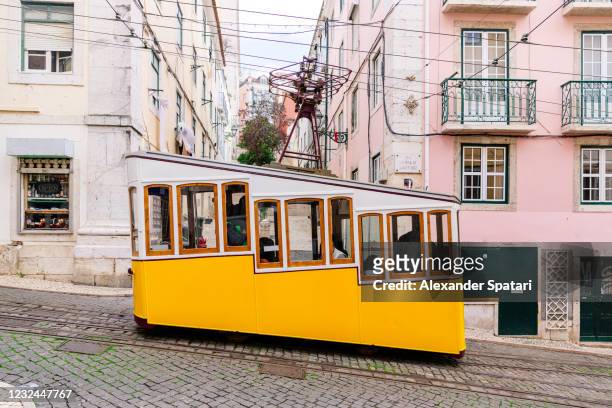 bica funcilar on the street of lisbon old town, portugal - tram stock-fotos und bilder