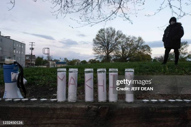 Letters on candles spell out Ma'Khia during a vigil in Columbus, Ohio on April 21, 2021 in memory of MaKhia Bryant who was shot and killed by a...