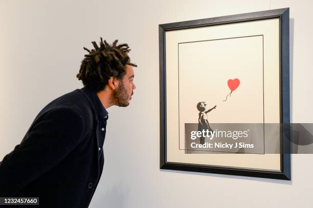 Girl With Balloon by Banksy at the "Millennials" show by digital art investments platform ARTCELS at HOFA Gallery on April 22, 2021 in London,...