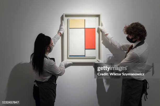 Staff members hold 'Composition: No. II, with Yellow, Red and Blue' oil on canvas by Piet Mondrian , property from an important private collection,...
