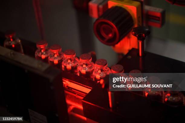 This picture taken in Monts, central France, on April 22 shows vials of the Moderna Covid-19 disease vaccine at Recipharm plant. Recipharm has been...