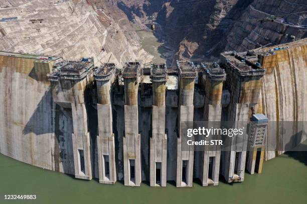 This aerial photo taken on April 22, 2021 shows the construction site of the Baihetan hydropower station in Zhaotong in China's southwestern Yunnan...