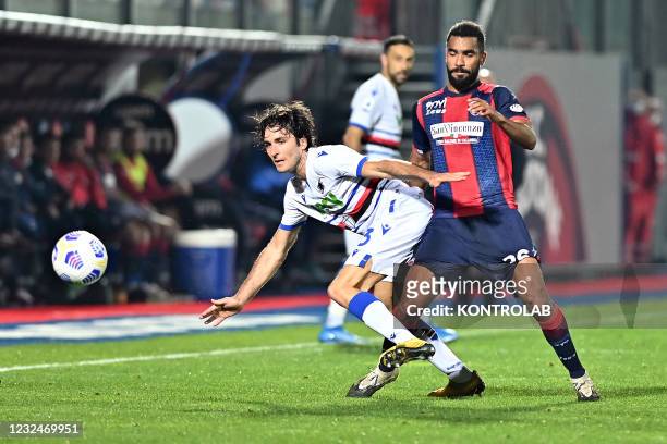 Sampdoria's italian defender Tommaso Augello fights for the ball against Crotone's ivorian defender Koffi Djidji during the Italian Serie A football...