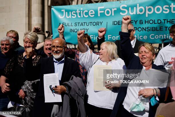 Former subpostmasters celebrate outside the Royal Courts of Justice in London, on April 23 following a court ruling clearing subpostmasters of...