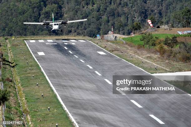 Private aircraft prepares to land at the Tenzing-Hillary airport in Lukla on April 23, 2021.