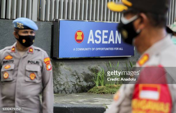 Security officers stand guard in front of the ASEAN Secretariat building ahead of the ASEAN Leaders' Meeting in Jakarta, Indonesia on April 23, 2021.