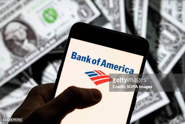 In this photo illustration the American multinational investment bank and financial services company, The Bank of America, l logo seen on an Android...