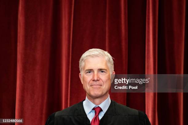 Associate Justice Neil Gorsuch stands during a group photo of the Justices at the Supreme Court in Washington, DC on April 23, 2021.