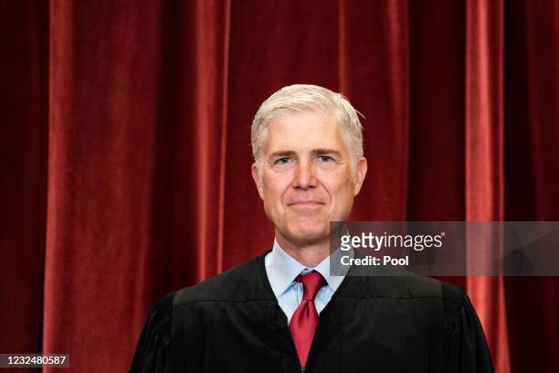 Associate Justice Neil Gorsuch stands during a group photo of the Justices at the Supreme Court in Washington, DC on April 23, 2021.
