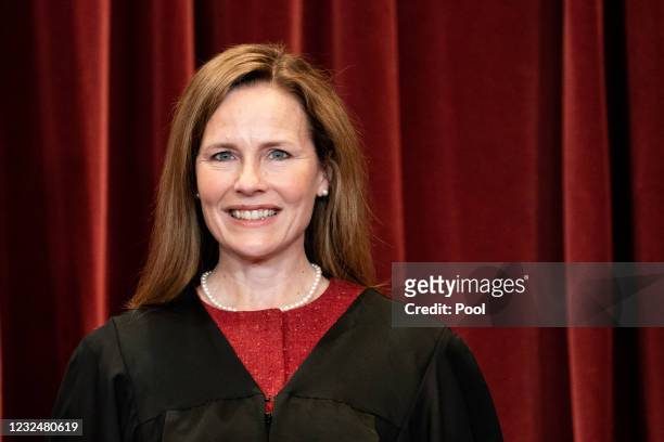 Associate Justice Amy Coney Barrett stands during a group photo of the Justices at the Supreme Court in Washington, DC on April 23, 2021.