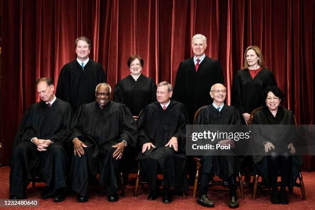 Members of the Supreme Court pose for a group photo at the Supreme Court in Washington, DC on April 23, 2021. Seated from left: Associate Justice...