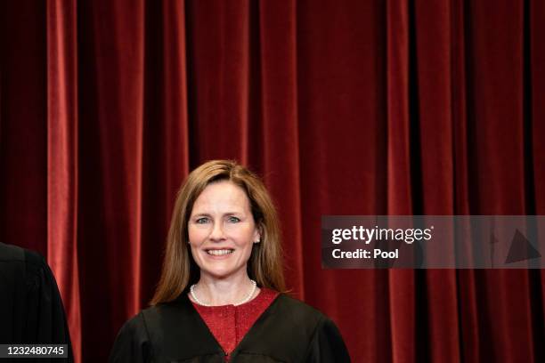 Associate Justice Amy Coney Barrett stands during a group photo of the Justices at the Supreme Court in Washington, DC on April 23, 2021.