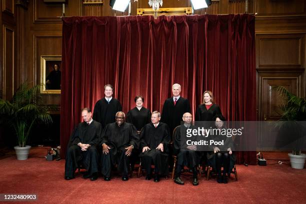 Members of the Supreme Court pose for a group photo at the Supreme Court in Washington, DC on April 23, 2021. Seated from left: Associate Justice...