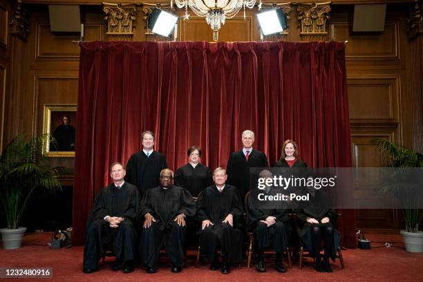 Members of the Supreme Court pose for a group photo at the Supreme Court in Washington, DC on April 23, 2021. Seated from left: Associate Justice...