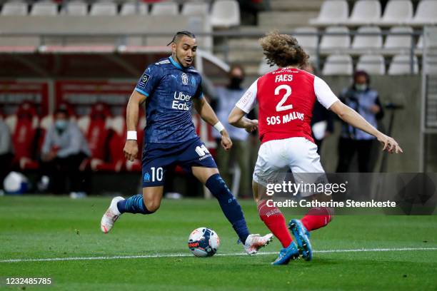 Dimitri Payet of Olympique de Marseille controls the ball against Wout Faes of Stade de Reims during the Ligue 1 match between Stade de Reims and...