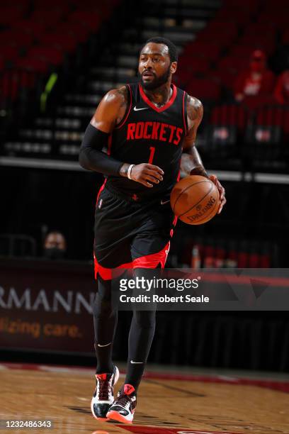 John Wall of the Houston Rockets dribbles the ball during the game against the Los Angeles Clippers on April 23, 2021 at the Toyota Center in...