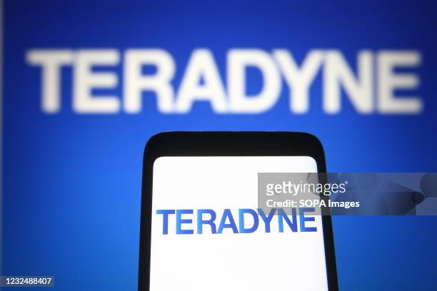 In this photo illustration, Teradyne logo of a US automatic test equipment designer and manufacturer is seen on a smartphone and a pc screen.