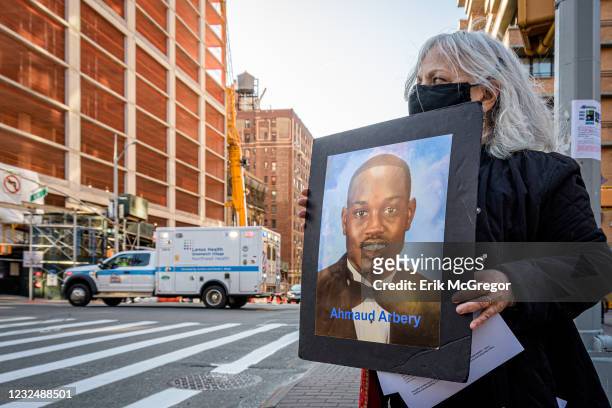 Participant seen holding a protrait of Ahmaud Arbery at the silent protest. Members of the activist group Rise And Resist gathered at 96th Street and...