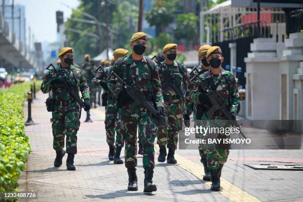 Indonesian soldiers provide security outside the Association of Southeast Asian Nations building in Jakarta on April 24 ahead of the ASEAN summit on...