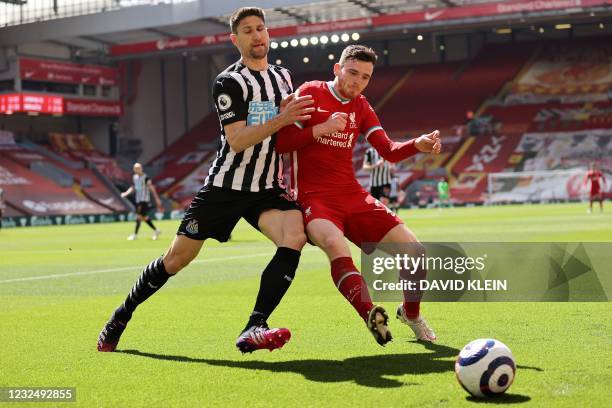 Newcastle United's Argentinian defender Federico Fernandez vies with Liverpool's Scottish defender Andrew Robertson during the English Premier League...