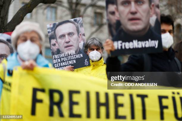 Activists from Amnesty International demonstrate outside the Russian embassy in Berlin, on April 24 calling for the release of Kremlin critic Alexei...