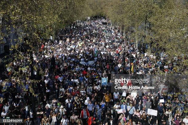 Protesters march during a "Unite For Freedom" anti-lockdown demonstration held to protest against the use of vaccine passports in the United Kingdom,...