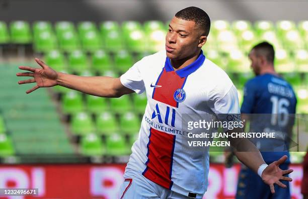 Paris Saint-Germain's French forward Kylian Mbappe celebrates after scoring a goal during the French L1 football match between Metz and Paris...