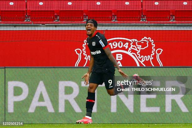Leverkusen's Jamaican midfielder Leon Bailey celebrates scoring the opening goal during the German first division Bundesliga football match between...