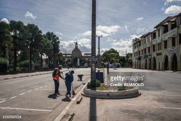Municipal agents sweep the streets of downtown Antananarivo after the Malagasy authorities decreed a total lockdown over the weekend in the capital...