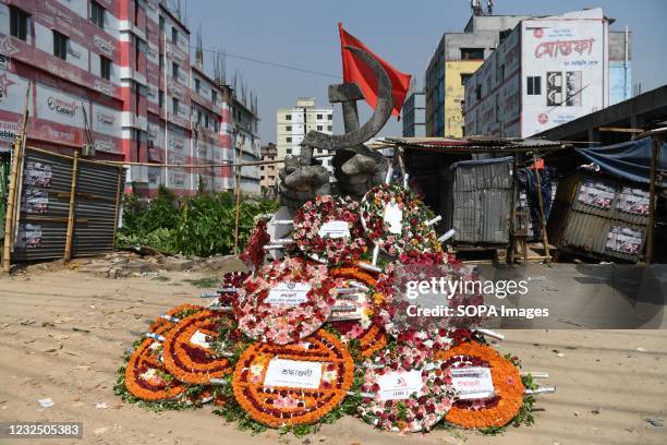 Flowers seen at the monument during the eighth anniversary of the Rana Plaza building disaster in Savar. One of the world's most devastating factory...