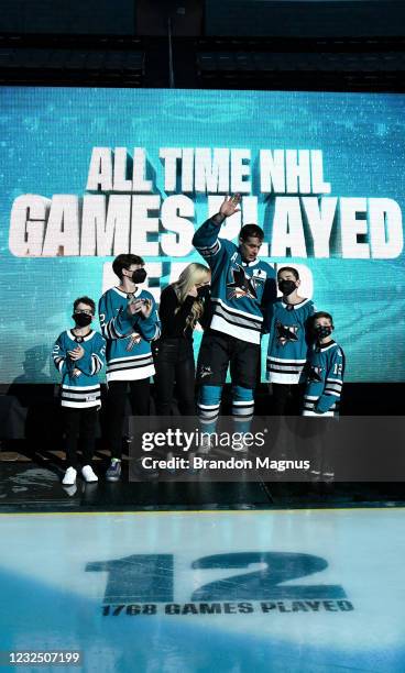 Patrick Marleau of the San Jose Sharks and his family wave to the crowd as he is honored for having passed Gordie Howe on the NHLs all-time games...