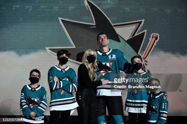 Patrick Marleau of the San Jose Sharks and his family look up at the video board as he is honored for having passed Gordie Howe on the NHLs all-time...