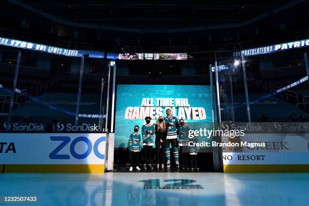 Patrick Marleau of the San Jose Sharks and his family look up at the video board as he is honored for having passed Gordie Howe on the NHLs all-time...