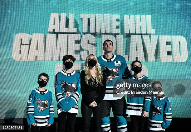 Patrick Marleau of the San Jose Sharks and his family look up at the video board as he is honored for having passed Gordie Howe on the NHLs all-time...