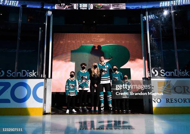 Patrick Marleau of the San Jose Sharks and his family look up at the video board as he is honored for having passed Gordie Howe on the NHLs all-time...