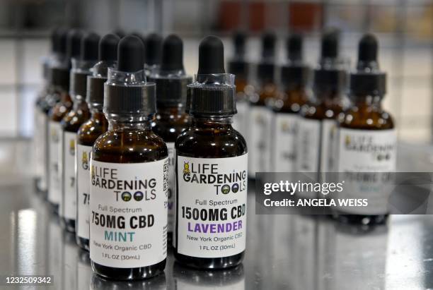 Oils are displayed at Empire Standard, a hemp extract processing and distribution plant, on April 13, 2021 in Binghamton, New York. - New York's...