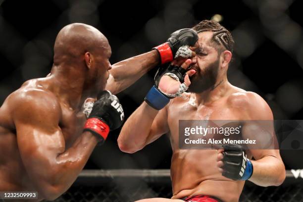 Kamaru Usman of Nigeria punches Jorge Masvidal of the United States during the Welterweight Title bout of UFC 261 at VyStar Veterans Memorial Arena...