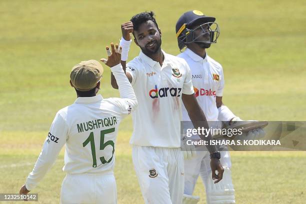 Bangladesh's Ebadat Hossain celebrates with a teammate after taking the wicket of Sri Lanka's Pathum Nissanka during the fifth and final day of the...