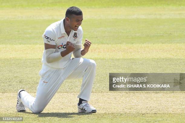 Bangladesh's Taskin Ahmed celebrates after taking the wicket of Sri Lanka's Dimuth Karunaratne during the fifth and final day of the first Test...