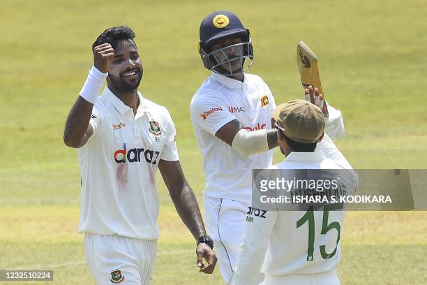 Bangladesh's Ebadat Hossain celebrates with a teammate after taking the wicket of Sri Lanka's Pathum Nissanka during the fifth and final day of the...