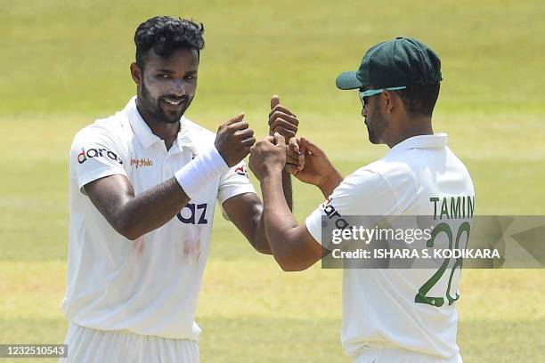 Bangladesh's Ebadat Hossain celebrates with a teammate after taking the wicket of Sri Lanka's Pathum Nissanka during the fifth and final day of the...