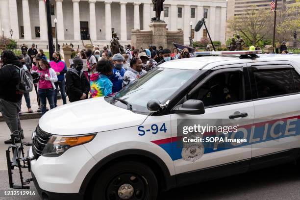 Columbus Police cruisers round the Ohio Statehouse interact with Black Lives Matter activists during the demonstration. Black Lives Matter activists...